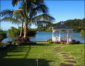 10 Vinyl Octagon Gazebo shown with Mahogany Composite Deck and Pewter Asphalt Shingles. 