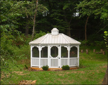 10 x 14 Treated Pine Oval Gazebo shown with optional Screens and Screen Door, White Paint, Clay Metal Roof and Cupola.