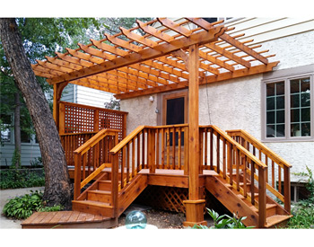 10 x 16 Cedar 2-Beam Wall Mount Pergola shown with cedar stain, lattice wall, 16" top runner spacing, and no deck. 