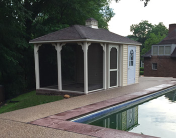 10 x 18 Vinyl Pool House shown with Almond siding and Ivory trim, cupola, gray composite deck, no rails, and aged redwood asphalt shingles. 