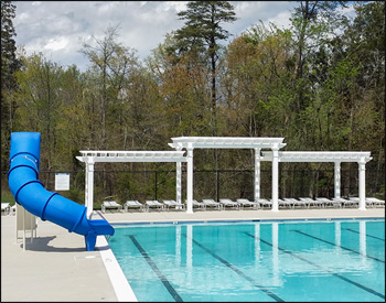 Our 10 x 40 Vinyl 3-Tier Solace Pergola is shown here with 6” Top Runner Spacing, No Deck, and Stainless Steel Hardware.