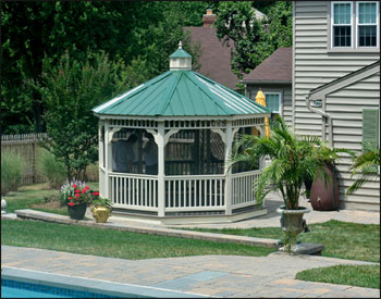 12 Vinyl Single Roof Octagon Gazebo shown with Harbor Gray Composite Deck and Evergreen Metal Roof.