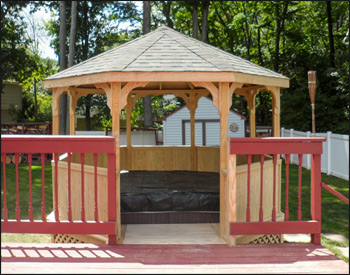 12 Treated Pine Octagon Gazebo shown with Solid Bottom Railing, Straight Posts, No top Railing Sections, Standard braces, Straight Fascia, No Cupola, Oxford Gray Asphalt Shingles, Hidden Wiring w/ 1 Receptacle & Switch, Bench Section and lattice side walls for gazebo deck. 