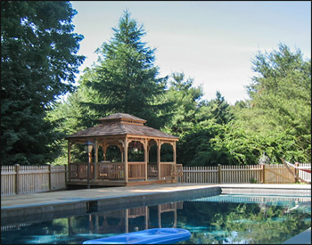 12 x 14 Cedar Rectangular Double Roof Gazebo shown with Cedar Deck, No Cupola, Wavy Fascia, and Cedar Shake Shingles. 