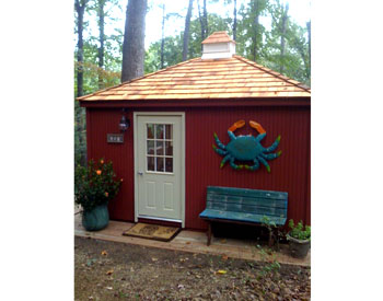 12x14 Cedar Rectangular Cabana shown with 7 insulated windows, cedar shingles, custom 4” grooved siding, with solid color stain, cupola, and finished interior and ceiling 