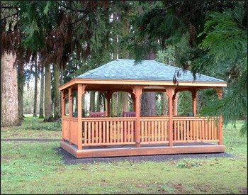 12 x 16 Cedar Rectangular Gazebo shown with Gray Composite Deck. 1x3 Railings, 36" High Railings, Standard Posts, Standard Braces, No Top Railing Section, Straight fascia, No Cupola, Cedar Tongue and Groove Ceiling, Rustic Evergreen Asphalt Shingles, Cedar Stain/Sealer, Stainless Steel Hardware, 4x4 Runners, and Hidden Wiring w/ 1 Receptacle and Switch.