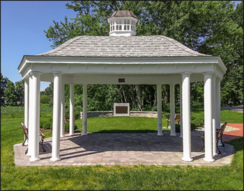 12 x 20 Vinyl Elongated Hexagon Belle Gazebo shown with 6" Round Smooth Columns, Old English Pewter Asphalt Shingles, Hidden Wiring with 1 Receptacle & Switch, 2 Additional Receptacles, and Cupola.