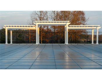 12 x 42 Vinyl 3-Tier Solace Free Standing Pergola shown with White Vinyl, 6" Top Runner Spacing, Galvanized Hardware, and Straight 8" Posts.