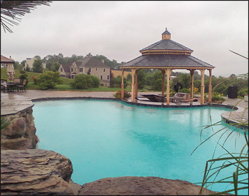 16 Cedar Octagon Double Roof Gazebo shown with no deck, no railings, straight posts, standard braces, no top railings, straight fascia, cupola, cedar tongue and groove ceiling, unstained, midnight gray rubber slate shingles, and hidden wiring w/ 1 receptacle & switch.