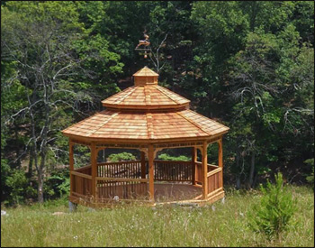 18 Cedar Octagon Double Roof Gazebo shown with Red Cedar Deck, 2x2 Square Rails, Cupola, Deer Weathervane, Clear Stain, and Cedar Shake Shingles. 