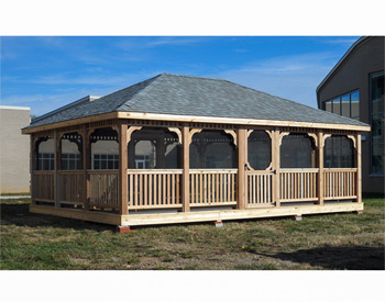 18 x 24 Cedar Rectangular Gazebo shown with Red Cedar Deck, 1x3 Standard Rails, Full Set of Screens and Screen Door, No Cupola, Old English Pewter Asphalt Shingles, Additional Door, and Bench Section.