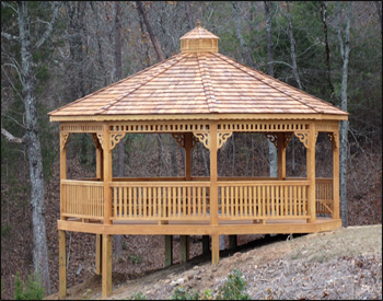 20 Treated Pine Octagon Gazebo shown with Treated Pine Deck, Decorative Braces, Cupola, Wavy Fascia, Customer Supplied Stain, and full set of Benches. 