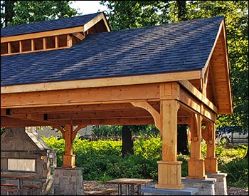 20 x 40 Alpine Heritage shown with Double Roof, 7 x 7 Posts, Clear Sealer, and Rustic Black Asphalt shingles. Stonework by 3rd Party.