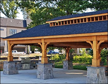 20 x 40 Alpine Heritage shown with Double Roof, 7 x 7 Posts, Clear Sealer, and Rustic Black Asphalt shingles. Stonework by 3rd Party.