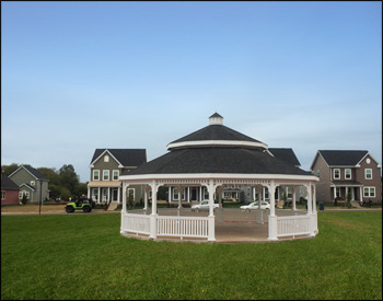 30 Treated Pine Dodecagon Double Roof Gazebo shown with 1x3 standard railings, standard braces, cupola, Treated Pine Tongue and Groove Ceiling, Old English Pewter Asphalt Shingles, white stain, stainless steel hardware, and Hidden Wiring w/ 1 Receptacle & Switch.