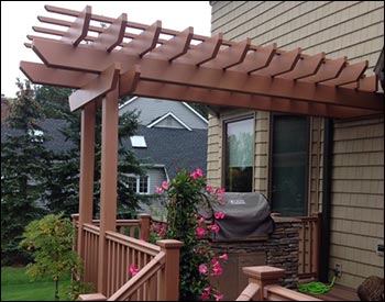 Custom Wall Mount 6x14 Fiberglass 2-Beam Pergola Shown Mounted on customers existing posts in Custom Color Paint - SW WHEAT PENNY (ANGLE 2).
