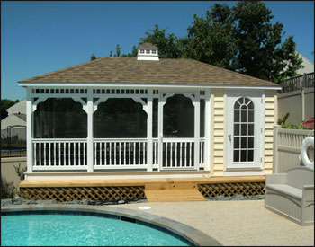 Custom (5’ enclosed) Pool House with Gray Composite Decking, Rustic Cedar Asphalt Shingles, Cupola, Optional Decorative Spindle Railings, Screens with Screen Door, Single Arched Door, Custom vinyl Siding 