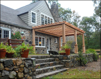 Custom 12x20 Cedar Deluxe 4 Beam Pergola Shown with Custom 8" Posts, Stainless Steel Hardware, No Corner Brackets, and 12" Top Runner Spacing 