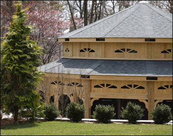 Custom 30 Treated Pine Dodecagon Double Roof Gazebo Shown with 9 Tall Posts, 36" High Solid Bottom Railing, Solid Top Rail, Standard Braces, 4 Track Window System with Screens, Screened Floor, Black Plexiglas at Double Roof, Grey Composite Decking, No Cupola, and Oxford Grey Asphalt Shingles.