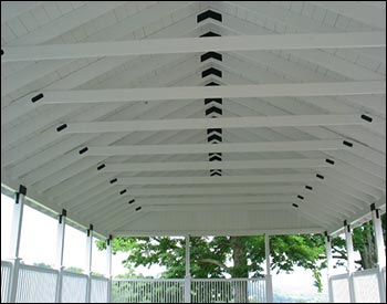 Roof Detail of 30 x 52 Treated Pine Closed Gable Rectangular Pavilion Shown with 44" tall railings, tongue and groove ceiling with 8’ eaves and 2’ overhang, Laminated Columns, T&G Deck, and White Paint. Note that collar ties may vary depending on structure load requirements.