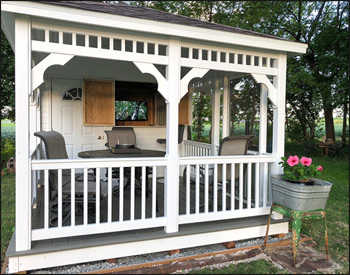 Vinyl Poolhouse shown with White Vinyl Siding, White Trim, Gray Composite Deck, Charcoal Gray Asphalt Shingles, Standard Railings, Two 24" x 36" Insulated Windows, 5 Wide Double Door, 3 Single Door, 4 Concession Bar, Screens, Cupola