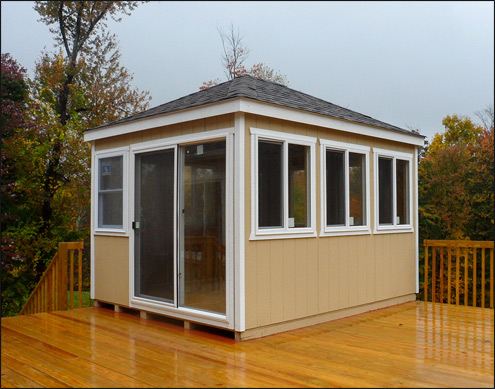  10 x 12 Dura-Temp Rectangle Cabana shown with Leola Almond Paint, White Trim, Plywood Floor, Eight 40" x 46" Horizontal Sliding Window, Standard Single Door, No Shutters, and Rustic Black Asphalt Shingles, Customers sliding glass door and smaller window.