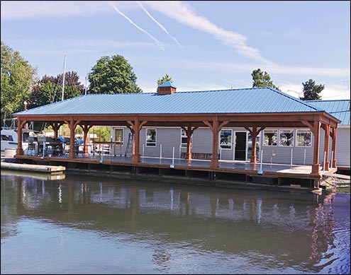 Custom 20 x 60 Treated Pine Ramada with Semi Transparent Cedar Stain, Gallery Blue Metal Roof, Custom Large Cupola, 7x7" Posts, 2x10" Headers, Custom Simpson Brackets, and Short Post Trim.