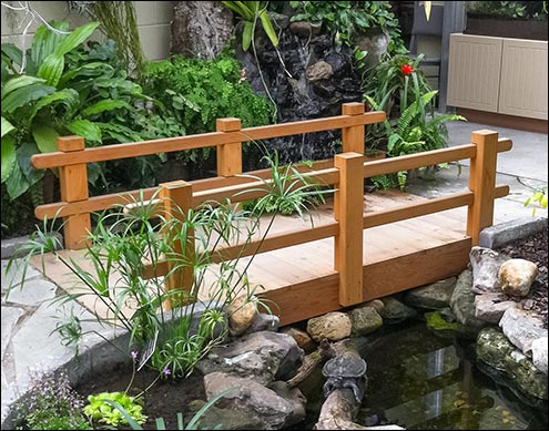 Custom 6 Red Cedar Camelot Double Rail Bridge shown with Cedar Stain/Sealer, No Post Caps, and Flat Beam for ADA compliance.