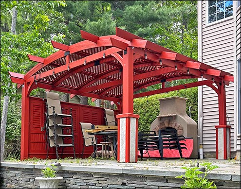 Custom 14 x 18 Red Cedar Arched Pergola with additional front and back beams, custom end-cuts, custom privacy panels, and customer-supplied stain.