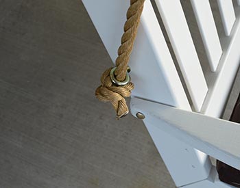 Rope Shown Strung Through Example Swings Back Hooks in a Closeup.