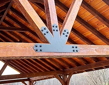 Decorative Gable Plate shown on a 26’ x 34’ Eastern Hemlock Ramada