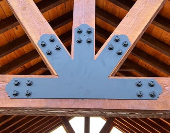 Decorative Gable Plate shown on a 26’ x 34’ Eastern Hemlock Ramada