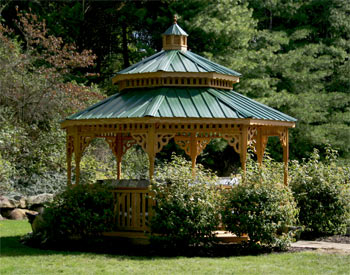 14 Treated Pine Octagon Double Roof Gazebo shown with Optional Decorative Braces, Turned Posts, Evergreen Metal Roof and Cedar Tone Stain/Sealer.
