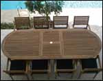 96" Teak Oval Expansion Table and Slat Back Stack Chair Set 