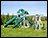 Castle Vinyl 2-Tier Swing & Slide Playset w/ Climbing Set & Rock Wall