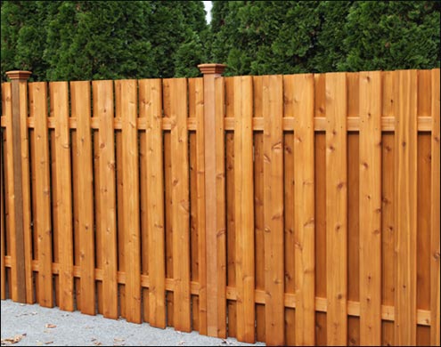 Western Red Cedar Shadowbox Style Fence with flat top post caps and Cedar Stain/Sealer shown. Shown in standard 6 height and 6 width between posts. <br/>(Also available in Treated Pine)