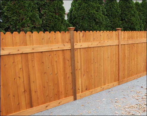 Western Red Cedar Straight Plank Style Fence with Dog Ears, Cedar Stain/Sealer, and pyramid top post caps shown. Shown in standard 6 height and 6 width between posts. <br/>(Also available in Treated Pine)