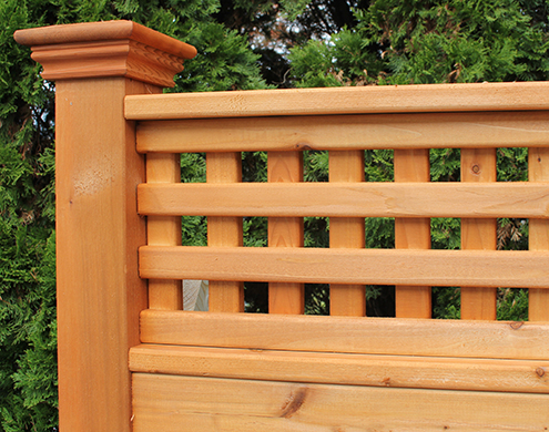 Close up of 12 inch Western Red Cedar straight lattice shown with<br/> Cedar Stain/Sealer and flat top post cap.(Also available in Treated Pine)